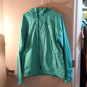Columbia lightweight teal waterproof jacket with hood.